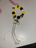 Yellow and black sunflower wristlet