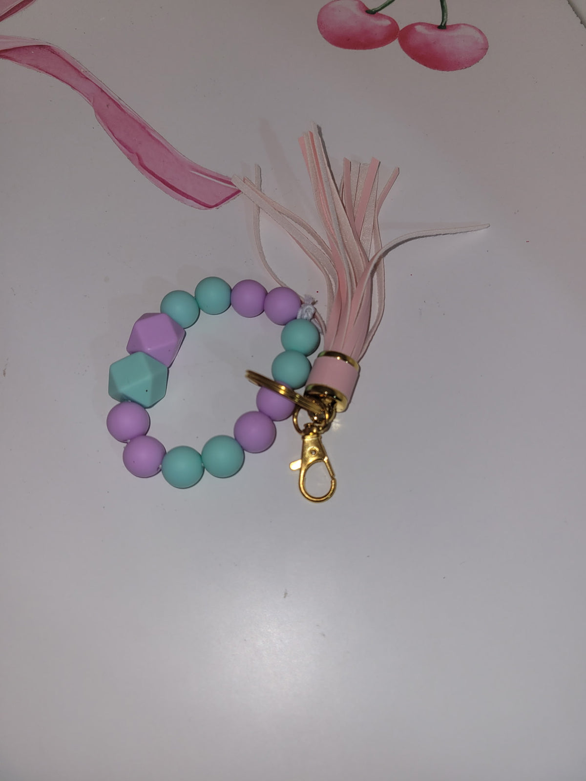 Teal and purple with pink wristlet