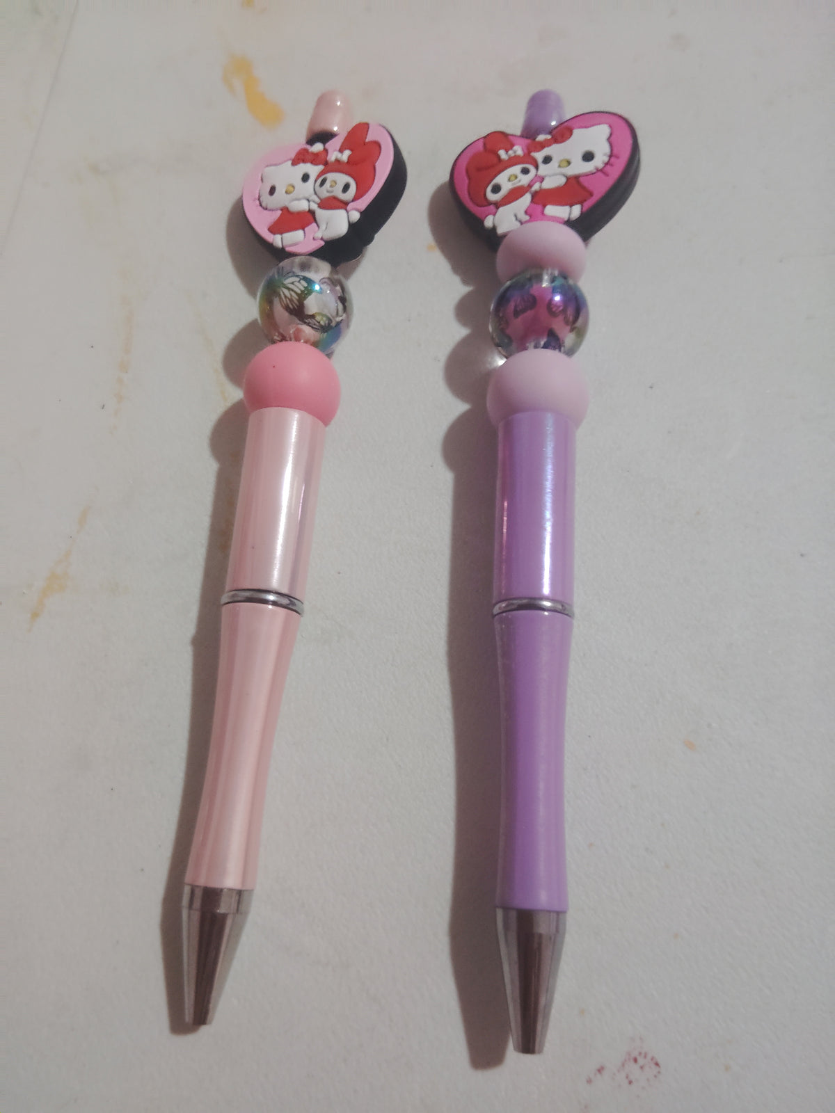 Pink or purple hello kitty beaded pens
